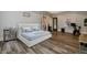 Spacious main bedroom with workout area, large bed, and light blue walls at 1762 Patrick Rd, Dacula, GA 30019