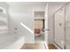 Bright bathroom with a soaking tub and separate shower featuring tile, plank floors and modern finishes at 8511 Polston Place- Lot 138, Douglasville, GA 30134
