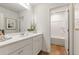Bright bathroom with modern vanity, sink, and shower/tub combination at 8511 Polston Place- Lot 138, Douglasville, GA 30134