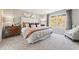 Inviting bedroom with soft carpet, neutral walls, and a view of the outdoors at 8511 Polston Place- Lot 138, Douglasville, GA 30134