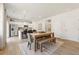 Cozy dining area with a rustic wooden table, modern decor, and an adjacent kitchen, perfect for Gathering meals at 8511 Polston Place- Lot 138, Douglasville, GA 30134