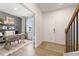 Inviting entryway with a view of a light-filled home office featuring stylish decor and a comfortable workspace at 8511 Polston Place- Lot 138, Douglasville, GA 30134