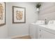 Convenient laundry room with modern appliances, shelving, and stylish decor at 8511 Polston Place- Lot 138, Douglasville, GA 30134