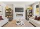 Stylish living room featuring a fireplace, built-in shelving, and neutral decor for a welcoming atmosphere at 8511 Polston Place- Lot 138, Douglasville, GA 30134