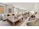 Open concept living room with bright natural light, elegant decor, and seamless flow to the kitchen at 8511 Polston Place- Lot 138, Douglasville, GA 30134