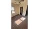 View of a bedroom exhibiting the need for remodeling, featuring bare walls, floors and a ceiling fan at 1099 Warren Dr, Riverdale, GA 30296