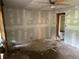 Bedroom being remodeled with ceiling fan, closet, and walls covered with drywall at 1099 Warren Dr, Riverdale, GA 30296