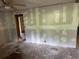 Bedroom being remodeled with ceiling fan, closet, and walls covered with drywall at 1099 Warren Dr, Riverdale, GA 30296