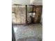 Interior showing the need for significant renovation with mosaic flooring, stove pipe, and weathered walls at 1099 Warren Dr, Riverdale, GA 30296