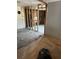 A partially renovated room exposing the framework with damaged hardwood floors at 1099 Warren Dr, Riverdale, GA 30296