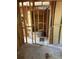 Interior view of a living room showcasing exposed wall studs during a remodeling project at 1099 Warren Dr, Riverdale, GA 30296