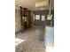 Interior displays mosaic flooring, stove pipe, and walls needing repair, with potential for renovation at 1099 Warren Dr, Riverdale, GA 30296