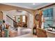 Inviting entryway with hardwood floors, an archway leading to the living room, and an abundance of natural light at 1705 Butler Bridge Rd, Covington, GA 30016