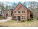 Beautiful two-story brick home featuring a well-manicured lawn and an attached two-car garage at 1705 Butler Bridge Rd, Covington, GA 30016