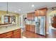 Updated kitchen with stainless steel appliances, granite countertops, and hardwood floors offering a modern appeal at 1705 Butler Bridge Rd, Covington, GA 30016