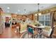 Charming kitchen with wooden cabinetry, granite countertops, and an eat-in breakfast nook with backyard views at 1705 Butler Bridge Rd, Covington, GA 30016