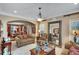 Cozy living room featuring neutral tones, decorative lighting, and an expansive view of the dining room at 1705 Butler Bridge Rd, Covington, GA 30016