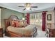Luxurious main bedroom with plush bedding, elegant curtains, and a relaxing ambiance at 1705 Butler Bridge Rd, Covington, GA 30016