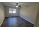 Bedroom features hardwood floors, ceiling fan, and window at 2825 Northeast Expy # F 03, Atlanta, GA 30345