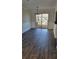 Dining area with hardwood floors and sliding glass door to outdoor deck at 2825 Northeast Expy # F 03, Atlanta, GA 30345