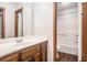 A bathroom shows a single vanity, a mirror, a sink, and a tub-shower combo at 495 Buttercup Trl, Lawrenceville, GA 30046