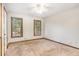A simple bedroom with neutral-colored walls, carpet, and natural light at 495 Buttercup Trl, Lawrenceville, GA 30046