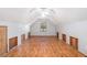 Large, bright room with hardwood floors, a window, trim, and multiple access panels at 495 Buttercup Trl, Lawrenceville, GA 30046