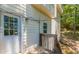 Back porch with access door, exterior light and a small set of stairs, offering a transition to outdoor space at 1850 Brooks Pointe Ct, Lawrenceville, GA 30045