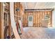 Unfinished basement with exposed framing, a door, and a window, presenting an opportunity for customization at 1850 Brooks Pointe Ct, Lawrenceville, GA 30045