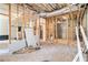 Unfinished basement with exposed ceiling, concrete floor and framing, offering potential for customization at 1850 Brooks Pointe Ct, Lawrenceville, GA 30045
