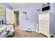 A bedroom with decorations on the wall and neutral carpets at 1850 Brooks Pointe Ct, Lawrenceville, GA 30045