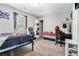 Comfortable bedroom with desk, neutral carpet, and space for decor at 1850 Brooks Pointe Ct, Lawrenceville, GA 30045