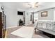 Spacious bedroom with ceiling fan, neutral carpet, and lots of natural light at 1850 Brooks Pointe Ct, Lawrenceville, GA 30045