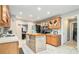 Bright kitchen features a center island, stainless appliances, and ample cabinet space at 1850 Brooks Pointe Ct, Lawrenceville, GA 30045