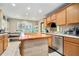 Spacious kitchen with stainless appliances, center island, and a breakfast nook at 1850 Brooks Pointe Ct, Lawrenceville, GA 30045