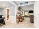 Inviting living room area with tile floors and warm light spilling in at 1850 Brooks Pointe Ct, Lawrenceville, GA 30045