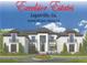 Elegant two-story home with balconies, manicured landscaping, circular driveway, and classic design elements at 1906 Knight Cir, Loganville, GA 30052