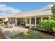 Home featuring a covered patio and well maintained lawn and landscaping at 201 Aster Ct, Canton, GA 30114