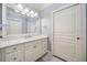 Bathroom featuring a vanity with a modern sink and traditional white cabinets at 201 Aster Ct, Canton, GA 30114