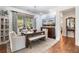 Dining area features a long wooden table, comfortable seating and great lighting at 201 Aster Ct, Canton, GA 30114