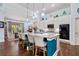 Kitchen island with white cabinets, bar stool seating, and decorative hanging lights at 201 Aster Ct, Canton, GA 30114
