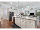 Kitchen island includes sink and dishwasher and has view into open living area at 201 Aster Ct, Canton, GA 30114