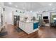 Spacious kitchen features an island with bar seating, open to the living area at 201 Aster Ct, Canton, GA 30114