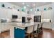 Stylish kitchen island with granite countertops, pendant lighting, and lots of cabinet storage at 201 Aster Ct, Canton, GA 30114