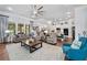 Spacious living area combines kitchen and seating with ceiling fan and lots of natural light at 201 Aster Ct, Canton, GA 30114