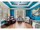 Comfortable sitting room with elegant furniture, hardwood floors, and bright accents offering a welcoming space at 201 Aster Ct, Canton, GA 30114
