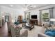 Inviting living room boasts a ceiling fan, large windows, and comfortable furniture at 201 Aster Ct, Canton, GA 30114