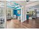 Inviting living space featuring hardwood floors, bright blue walls, and elegant decor providing a cozy atmosphere at 201 Aster Ct, Canton, GA 30114