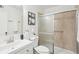 Bathroom with tiled shower, modern vanity, and decorative accents at 2201 Huntingdon Chase St, Atlanta, GA 30350