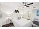 Bright bedroom with ensuite bathroom, dark floors, modern decor, and ceiling fan at 2201 Huntingdon Chase St, Atlanta, GA 30350